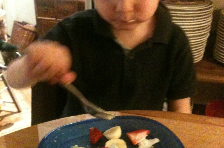 The boy likes fruits!